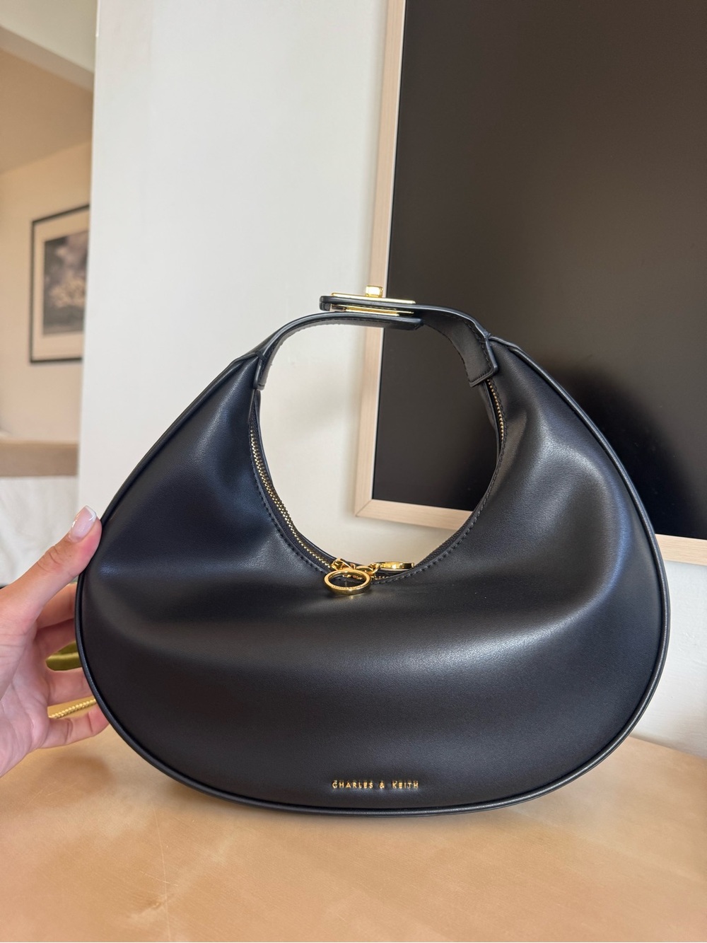 Charles & Keith Black Crescent Shoulder Bag with Gold Hardware
